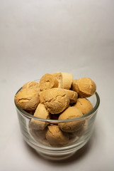 Candy in a bowl on white background