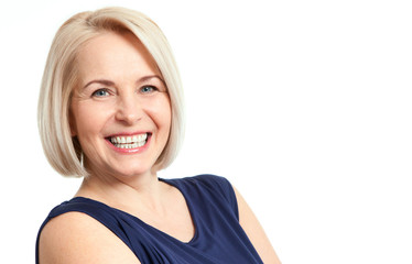 Friendly smiling middle-aged business woman isolated on white ba