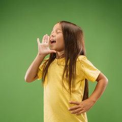 Do not miss. Young casual teen girl shouting. Shout. Crying emotional teenager screaming on studio...