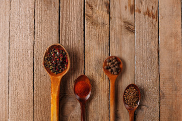 Pepper seeds in wooden spoons