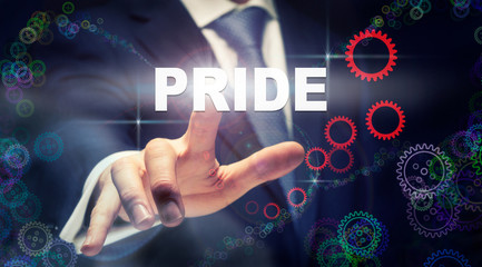 A businessman pressing a Pride business concept on a graphical display of cogs