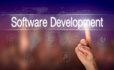 A hand selecting a Software Development business concept on a clear screen with a colorful blurred background.