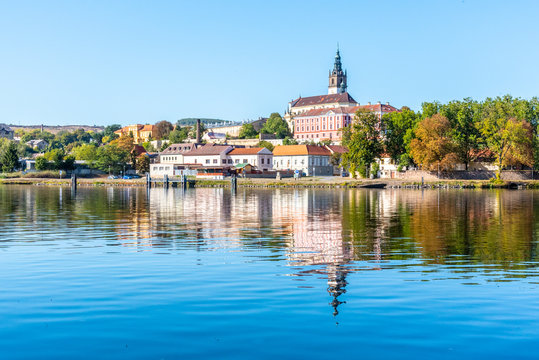 Panoramic cityscape of Litomerice reflected in Labe River, Czech Republic.