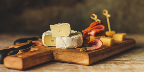 camembert cheese (cheese platter delicacies) groceries. Brie cheese top view.