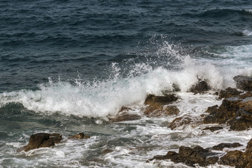 waves crashing on rocks