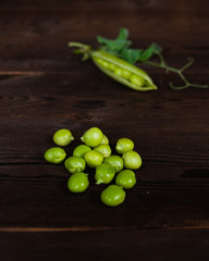 green peas on wooden background