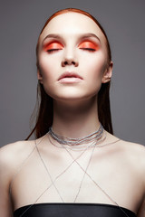 beauty make-up girl with orange eye shadow