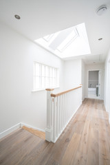 Bright hallway with stairs in a house