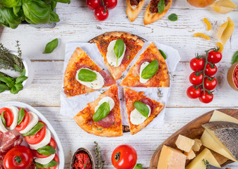 Various kind of italian food served on wood