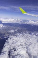 aircraft window onto jet engine, wing of airplane - view through the window