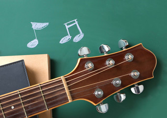 music school concept , guitar , books and blackboard 