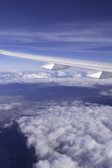 aircraft window onto jet engine, wing of airplane - view through the window
