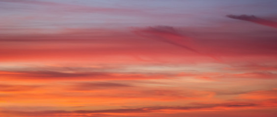 Sunset orange blue pink sky with clouds 