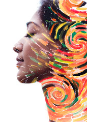 Paintography. Double exposure portrait of a beautiful pensive exotic woman combined with...