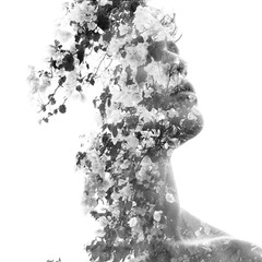 Double exposure of a young sexy man’s portrait blended with a flowering tree, in black and white