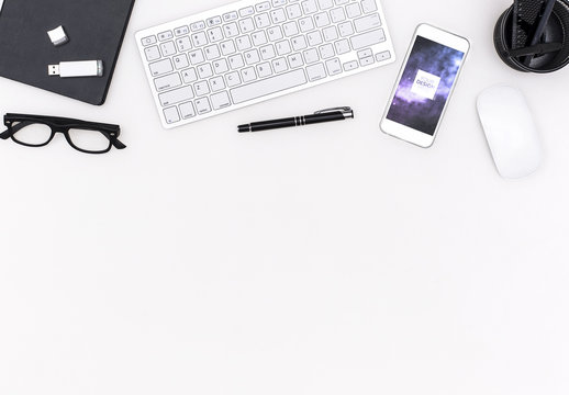 Smartphone on White Desk Mockup	