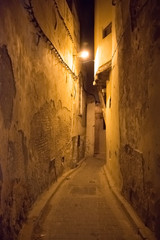 Fototapeta na wymiar Night old narrow street of the largest medina in the worlds, Unesco, Fez, Morocco in Africa