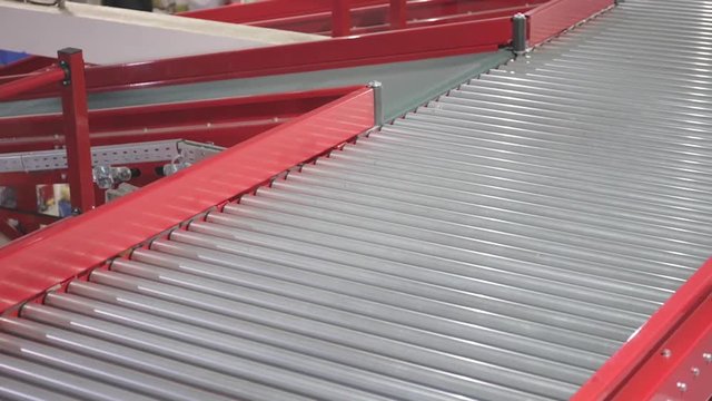 Empty Transport Rollers and Conveyor Belt in Warehouse