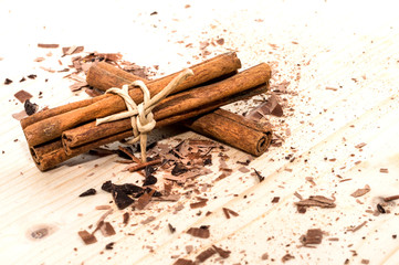 View of cinnamon sticks on wooden background
