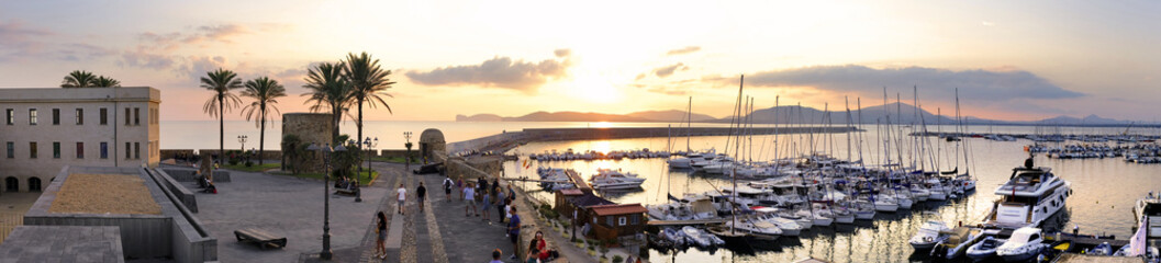 Alghero, Italy - Panoramic view of the Alghero historic quarter and marina with St. Elm Tower © Art Media Factory