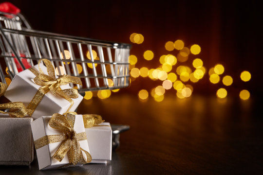 Gift boxes on shopping trolley.