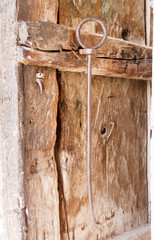 Old monastery wooden door details with metal parts