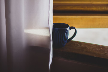 Caneca na Janela
