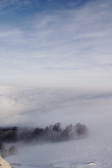 Obraz na płótnie Canvas Winter peyhazh mountains in the fog
