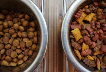dry food for domestic cats and dogs in an iron bowl