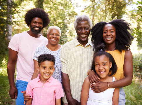 Multi generation black family in a forest, close up portrait