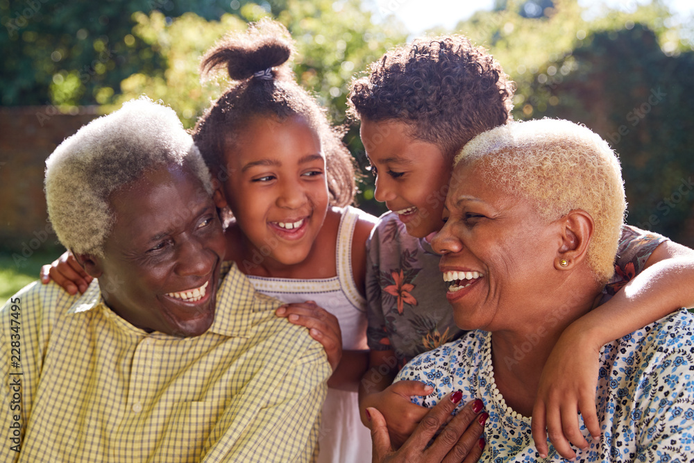 Wall mural senior black couple and grandchildren outdoors, close up