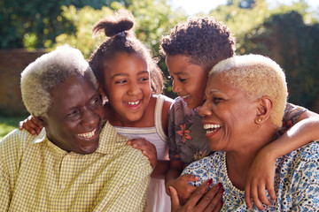 Senior black couple and grandchildren outdoors, close up
