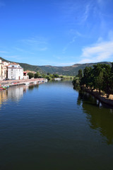 Fototapeta na wymiar view over the river temo in sardinia, panoramic view on the boats on the river temo in Bosa in Sardinia including typical colorful Italian houses these are reflected in the river