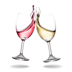Cheering wine with splashing out of glass isolated on white background.