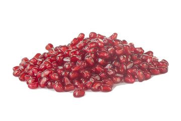 heap of red pomegranate isolated on white background