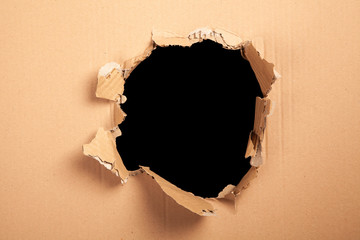 Cardboard with a hole - black background