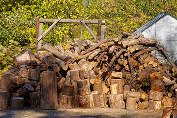 Backyard firewood supply ready to burn in a fireplace.