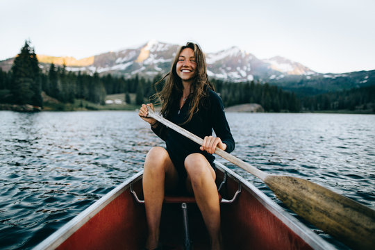 Smiling woman in canoe