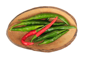 heap of chili pepper in shell of coconut isolated on white background