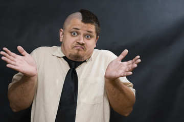 Punk. White shirt and dark tie. On the face an expression of misunderstanding and innocence. Hands...
