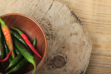 heap of chili pepper on wooden background