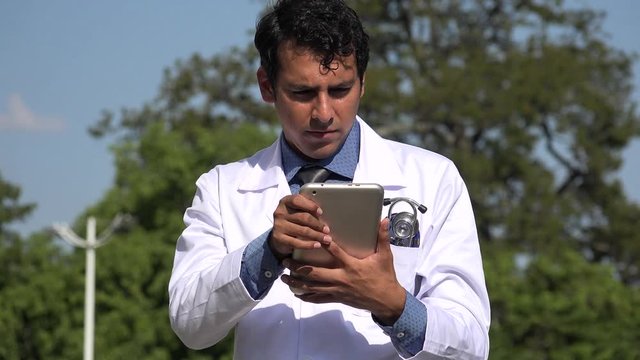 Hispanic Doctor Using Tablet