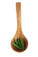 heap of green chili pepper in wooden spoon isolated