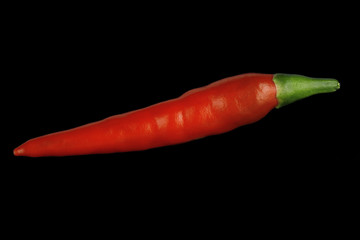 fresh red chili pepper isolated on black background