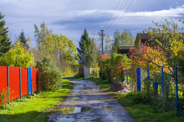 Fototapeta premium Street in the village after the autumn rain
