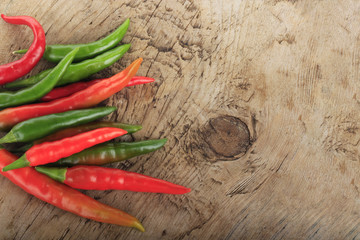 heap of chili pepper on wooden background