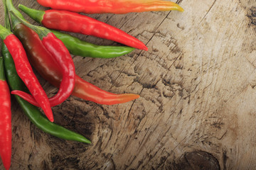 heap of chili pepper on wooden background