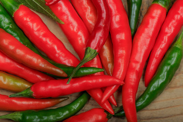 heap of red chili pepper on wooden background