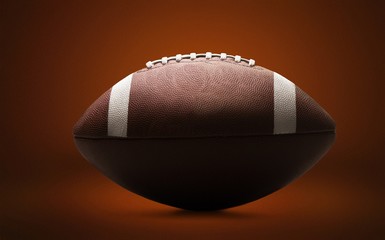 American football ball on background