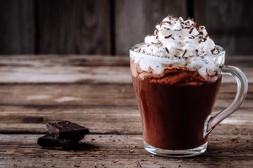 Printed kitchen splashbacks Chocolate Hot chocolate drink with whipped cream in a glass on a wooden background